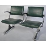 A 1970's retro polished steel twin seat barbers salon waiting chairs - armchairs having green