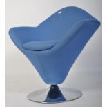 After Verner Panton. A 20th century Verner Panton style cone chair being raised on chrome terraced