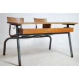 A large retro double school desk of French origin having tubular metal frame with slatted seat and