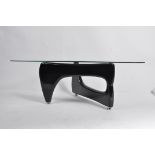 A good contemporary Isamu Noguchi coffee table - occasional table having glass top raised over a
