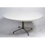 A 1960's white laminate circular coffee table in the manner of Arkana raised on a chrome support.