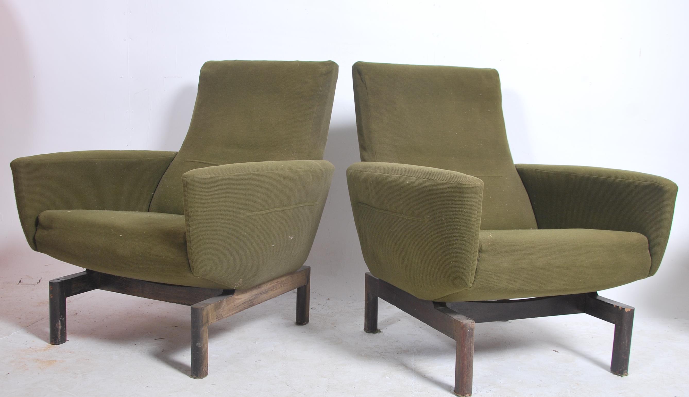 A stunning pair of mid century armchairs in the style of Pierre Guariche / Joseph Andre motte. The