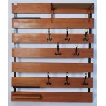 A mid century retro teak wood slatted modular wall coat rack stand. The seven teak wood slats having