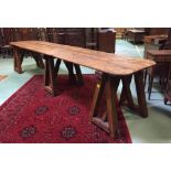 An exceptional large trestle table of oak form having oversized 3 trestle supports having a very