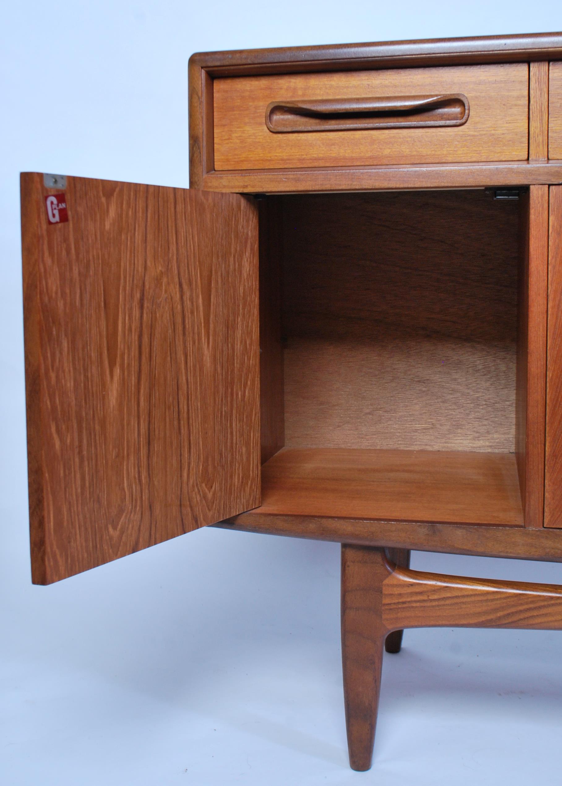 A 1970's retro G-Plan ' Fresco ' pattern teak wood sideboard being raised on tapered supports having - Image 5 of 6