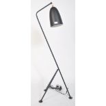 After Greta Grossman, a large black grasshopper floor lamp. Having a tubular steel tripod frame with