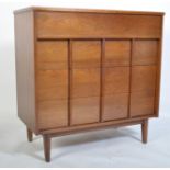 A superb mid century teak chest of drawers by Gibbard. The chest with vertical pull handles to the