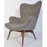 After Ernest Race. A DA1 style armchair raised on turned and tapering supports upholstered in a good