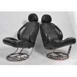 A pair of Industrial leather car chair - armchairs in the manner of Ron Arad being designed and