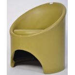 A retro vintage vinyl tub chair designed by Roger Bennett as part of the Gogo antique furniture