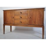 An original mid century Gordon Russell walnut sideboard / dresser. Raised on squared legs with a