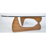 A good contemporary Isamu Noguchi coffee table - occasional table having glass top raised over a