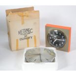 A superb vintage Metamec  mains powered wall clock with black face, white numerals and hands and