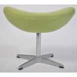 After Arne Jacobsen. A polished steel and green fabric upholstered egg stool - foot stool. The
