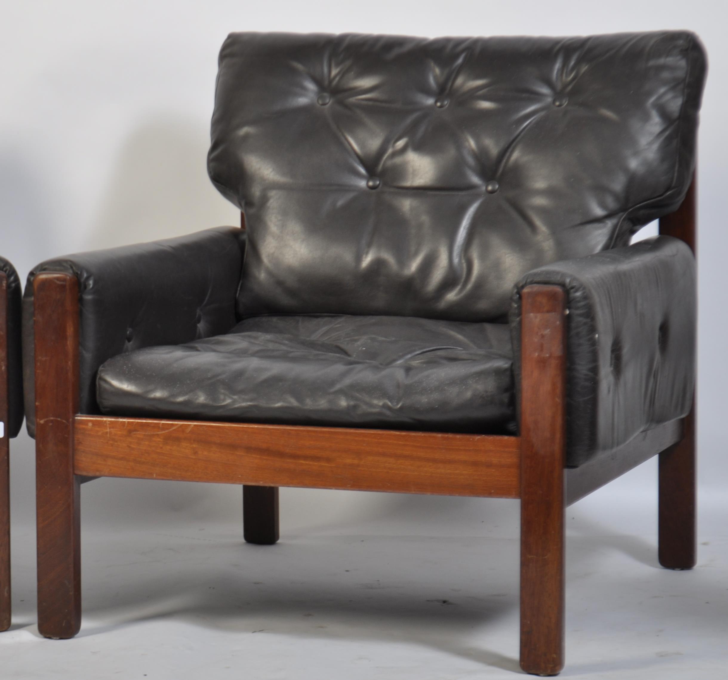 A stunning pair of 1960's teak and leather Danish armchairs. The black leather cushions being button - Image 3 of 4