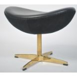 After Poul Volther. A stunning black leather and gilded polished steel Corona footstool / foot