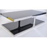 A superb 1970's chrome and black glass coffee table of angular form with chrome rectangular twin
