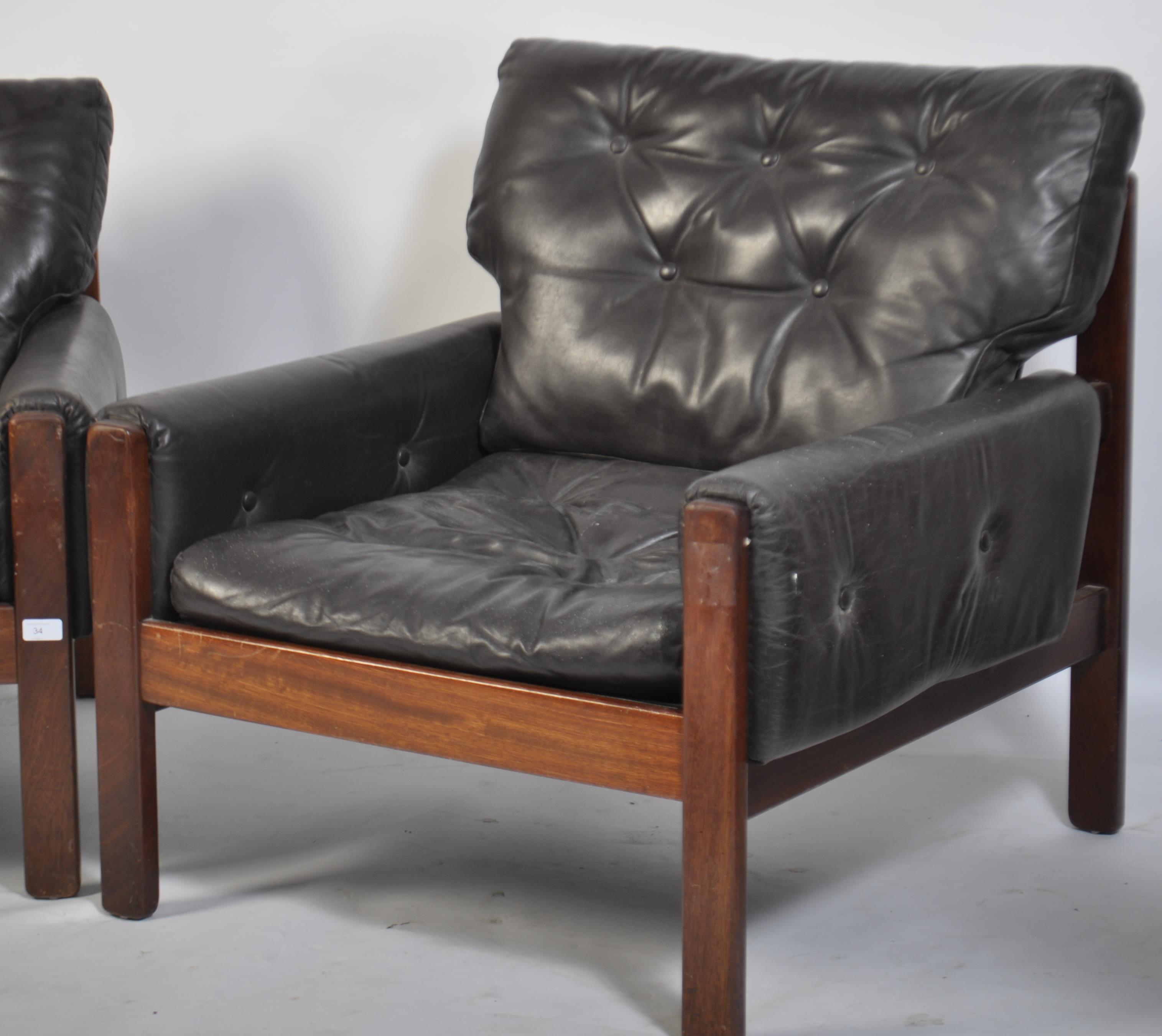 A stunning pair of 1960's teak and leather Danish armchairs. The black leather cushions being button - Image 4 of 4