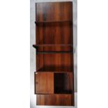 A rare mid century Danish rosewood modular wall system having a large rosewood panel back with