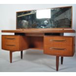 A 1970's G-Plan teak wood dressing table in the manner of Mogens Kolo. The dressing table raised