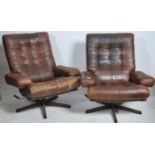 A pair of retro mid century Swedish leather patchwork upholstered swivel armchairs by Gote Mobler