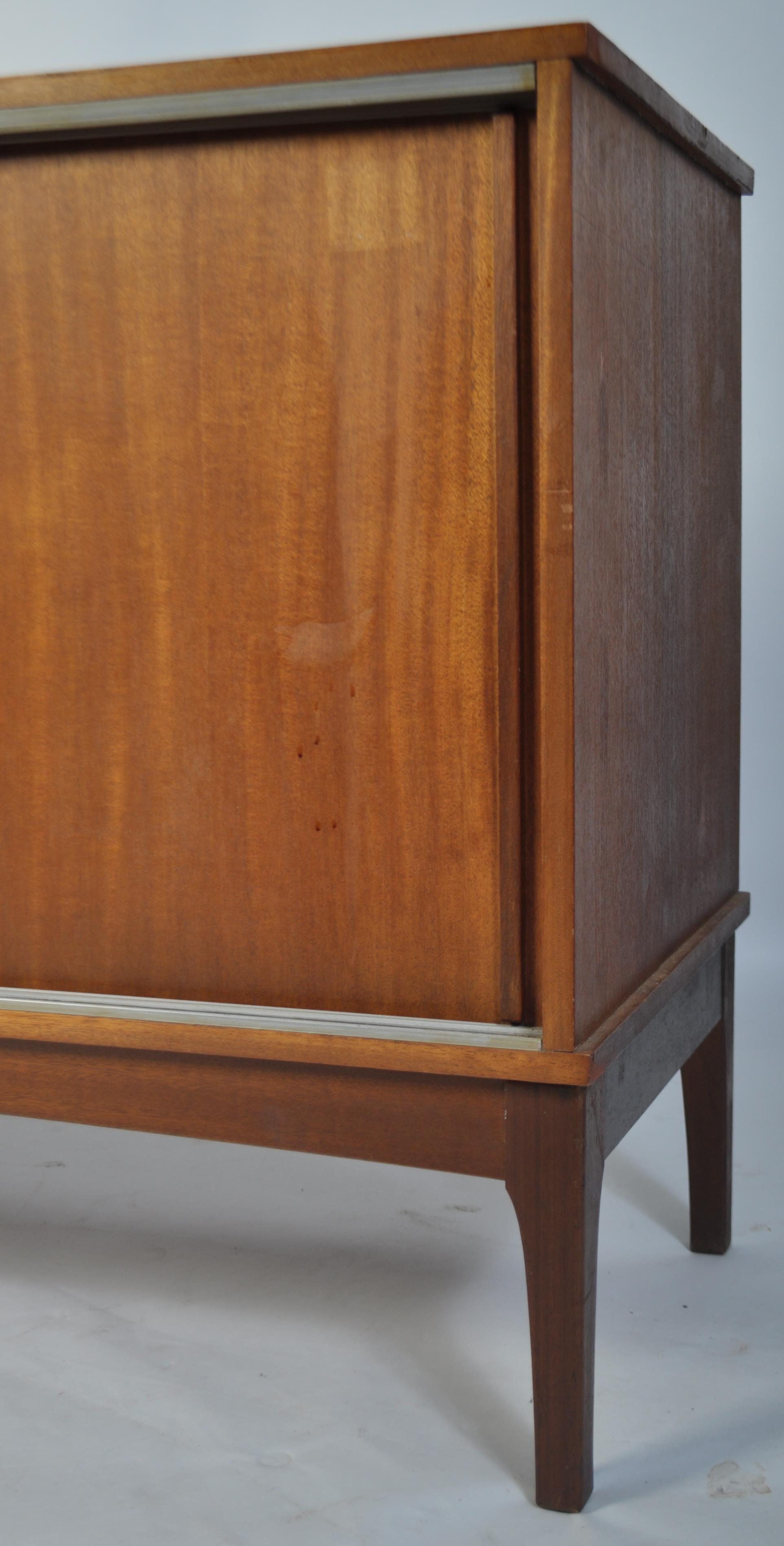 A retro mid century teak wood sideboard having a beehive angular facia comprising a series of - Image 3 of 5