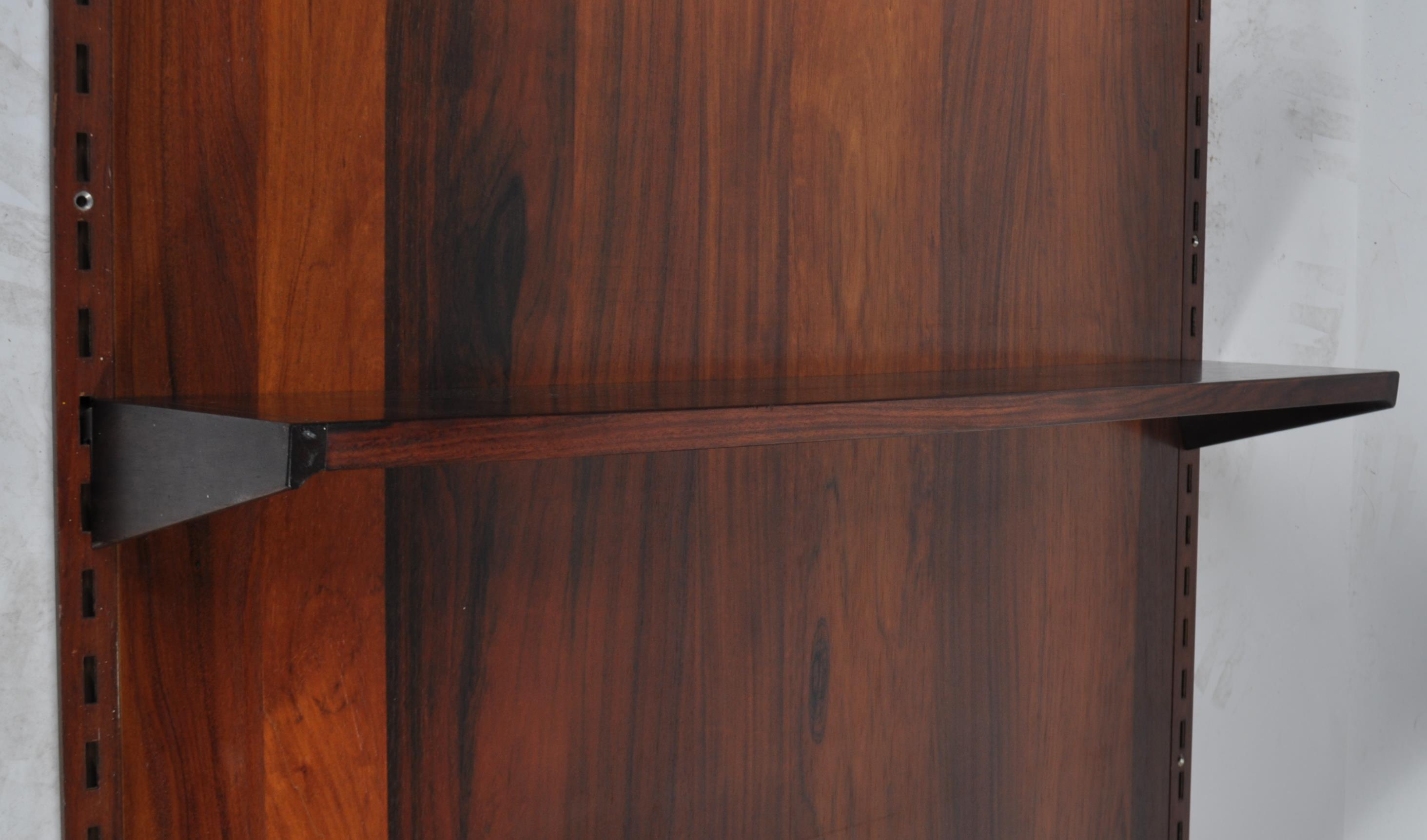 A rare mid century Danish rosewood modular wall system having a large rosewood panel back with - Image 7 of 10