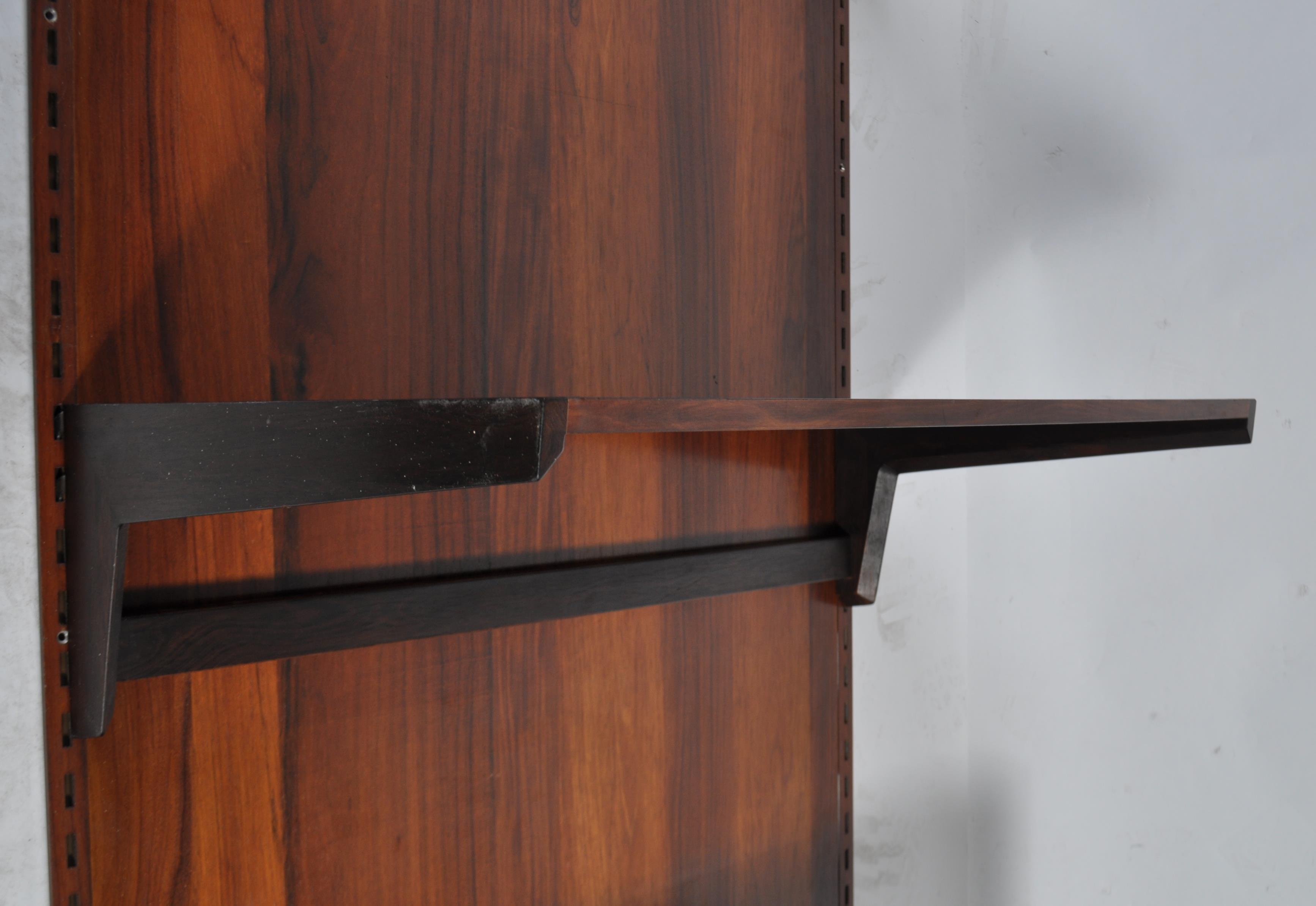 A rare mid century Danish rosewood modular wall system having a large rosewood panel back with - Image 5 of 10