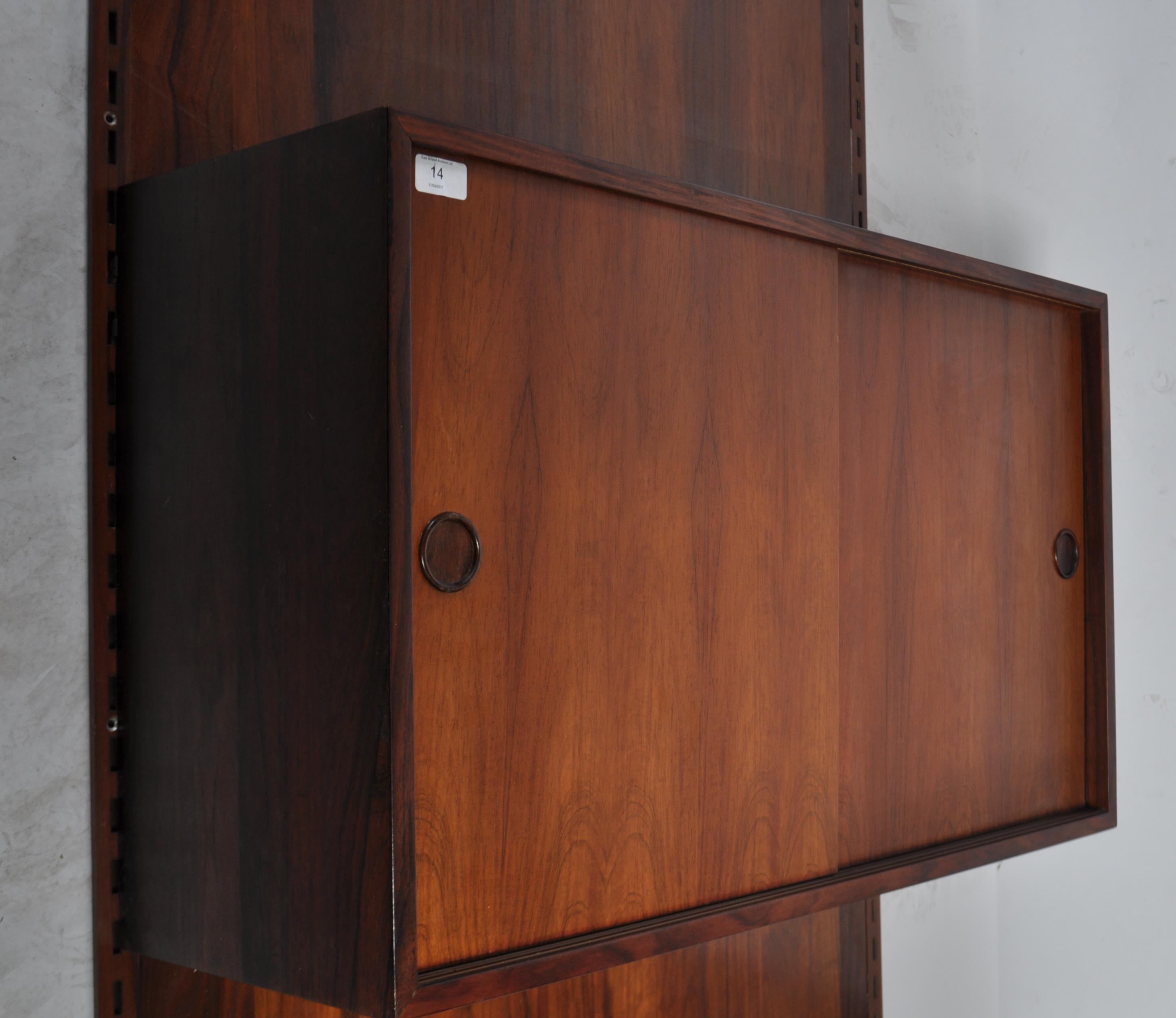 A rare mid century Danish rosewood modular wall system having a large rosewood panel back with - Image 4 of 10