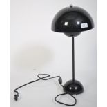 A contemporary flowerpot desk lamp in black by Louis Poulsen for Verner Panton. Domed half spheres