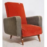 A 1970's French retro two tone armchair being raised on turned and tapering angled teak legs