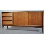 A retro mid century teak wood sideboard having a beehive angular facia comprising a series of