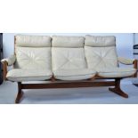 A Danish mid century teak and leather slatted sofa settee having a stunning bentwood slatted back