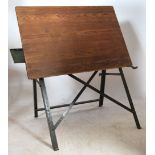 A mid century Industrial architects / draftsmans board having a panel wood board set over a cast