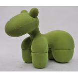 After Eero Aarnio, a 1970's pony chair stool - Giddy Up Pony being upholstered in a green fabric.