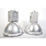 A pair of 20th century Industrial Hillclare factory pendant lights having half sphere polished