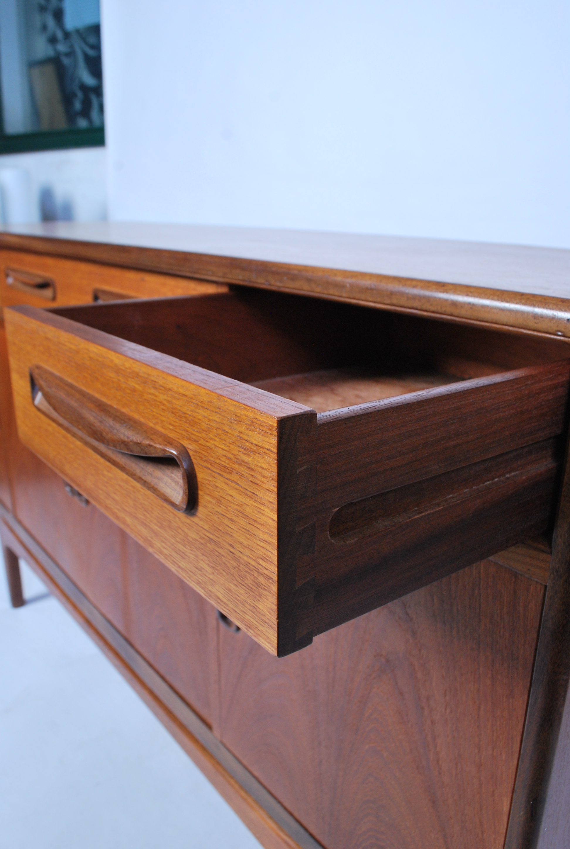 A 1970's retro G-Plan ' Fresco ' pattern teak wood sideboard being raised on tapered supports having - Image 3 of 6