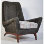 A 1960's Greaves & Thomas teak wood armchair. The base of teak with stunning low show wood frame