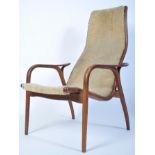 A 20th century Yngve Ekstrom beech framed lamino easy chair - armchair with believed fabric