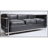 After Le Corbusier. A beautiful  ' LC2 ' type black leather and chrome sofa. The polished chrome