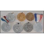 A small collection of commemorative medals dating