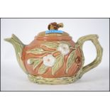 A 20th century Majolica teapot in the manner of Ge