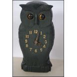 A Black Forest style clock in the form of an owl w