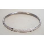 A sterling silver bangle bracelet of circular form