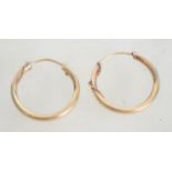 A pair of 9ct gold ladies hoop earrings having a r