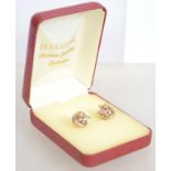 A pair of 9ct gold trilogy earrings of knot form w