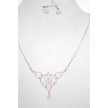 A silver and moonstone necklace and earrings demi-