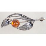A sterling 925 silver and amber leaf brooch having