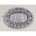 A Victorian silver filigree and foliate brooch hav