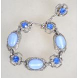 A heavy 1960s bracelet having blue rhinestones and